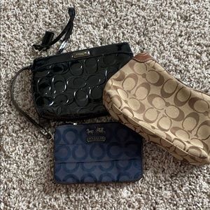 3 Coach wristlets